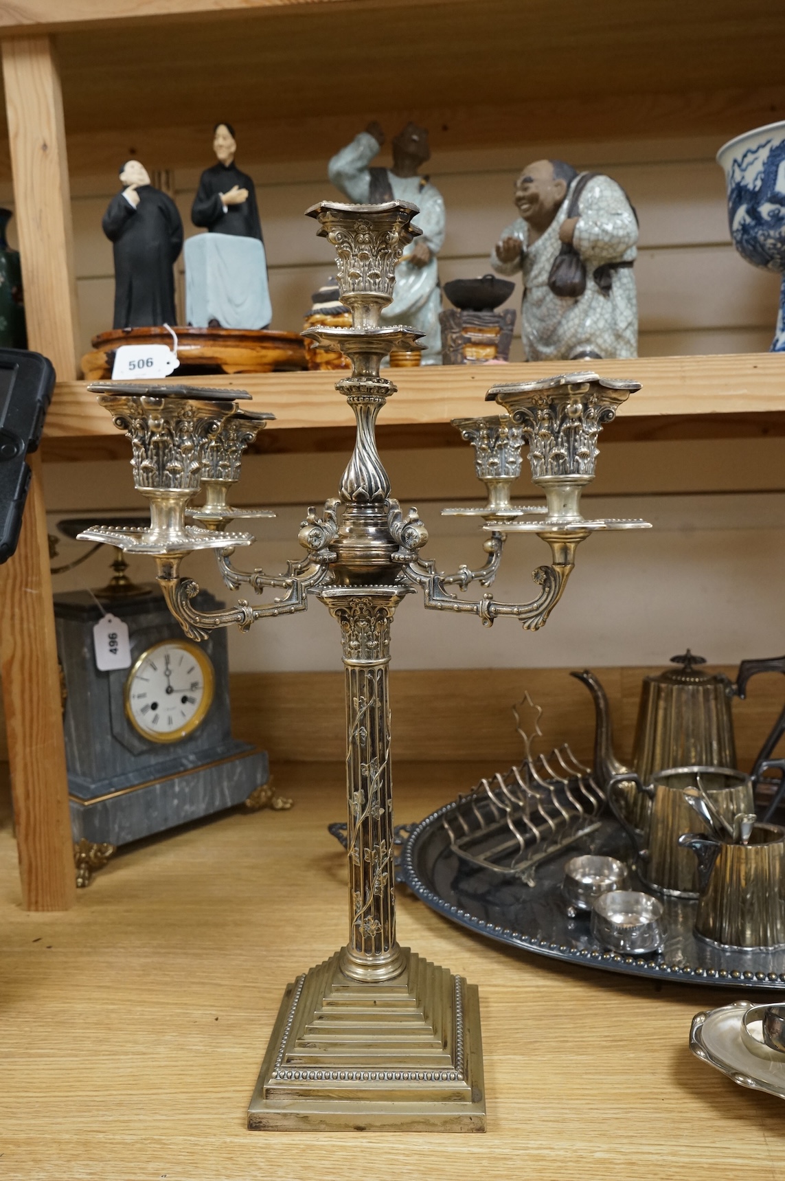 A collection of Victorian plated wares to include a pair of Corinthian column candelabra, 54cm